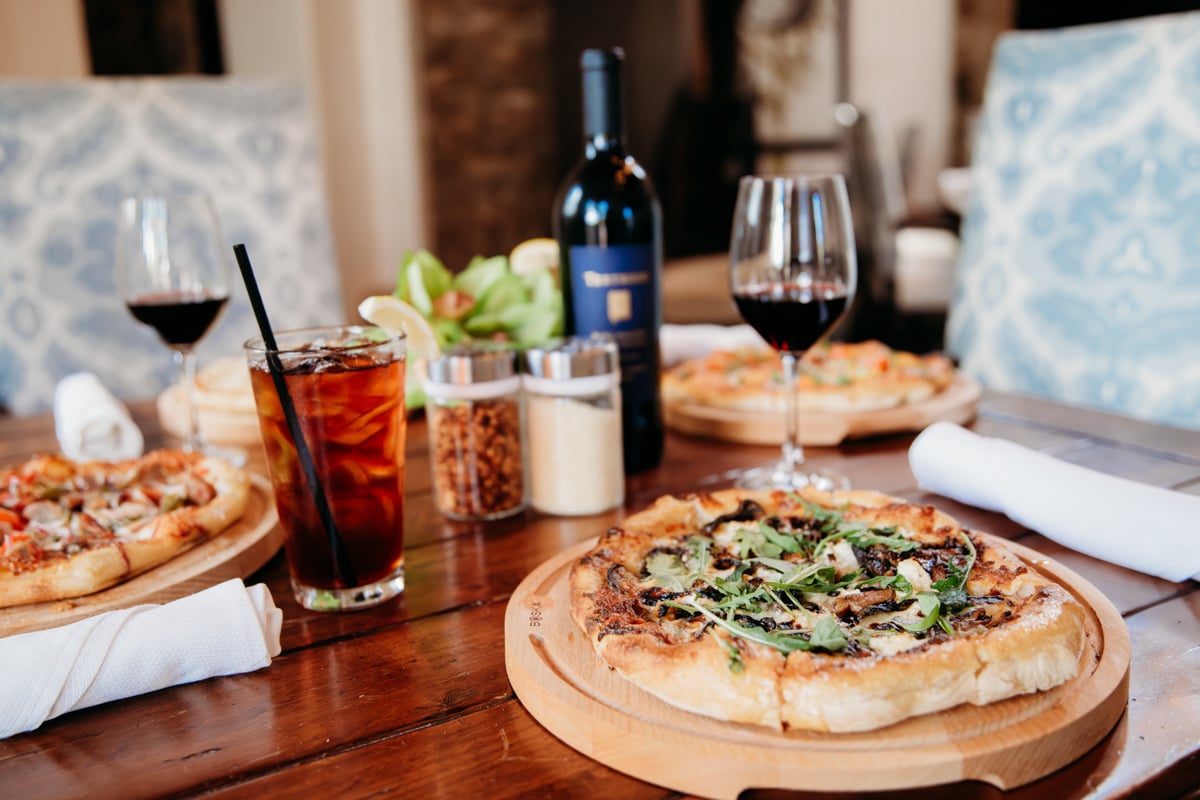 Pizza and wine on Clubhouse patio table