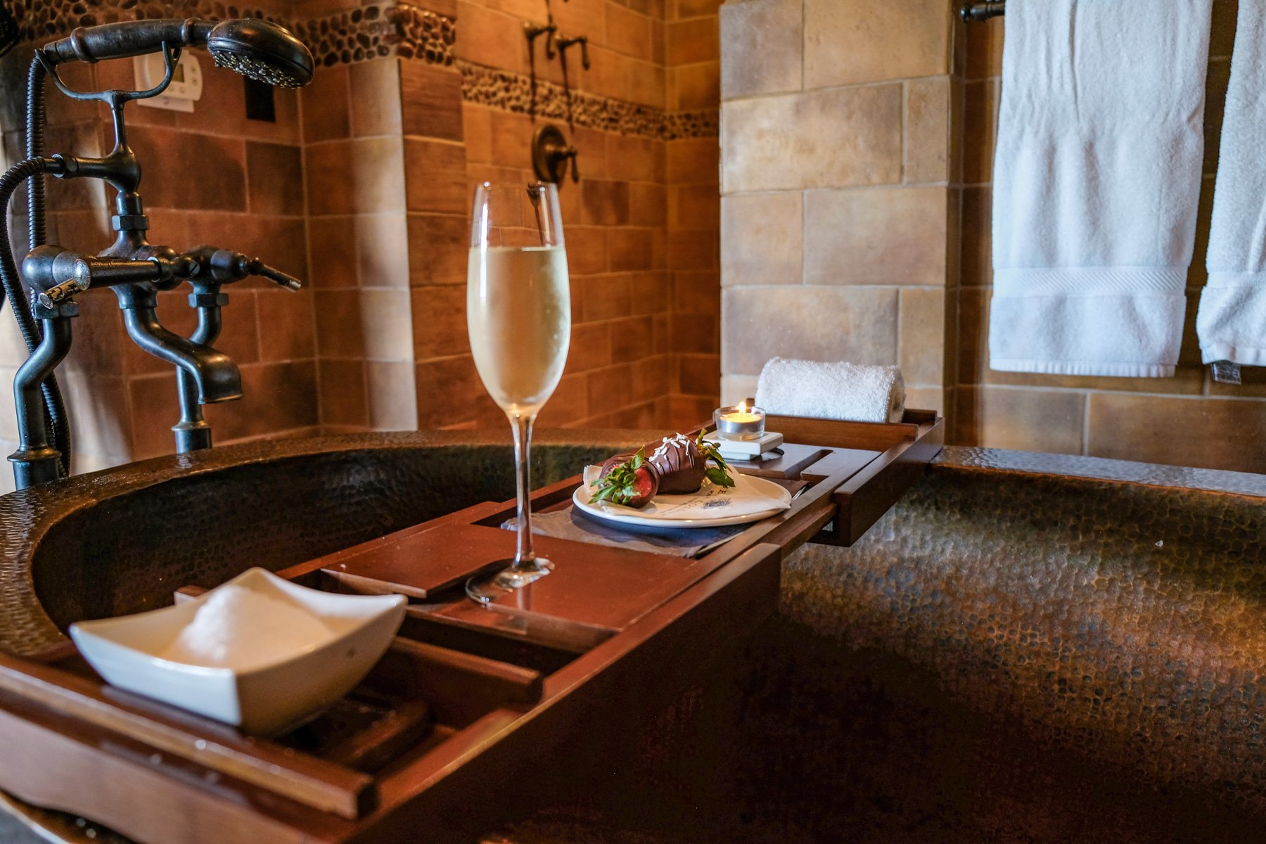 Champagne and spa refreshments beside a soaking tub at The Spa at Bella Collina