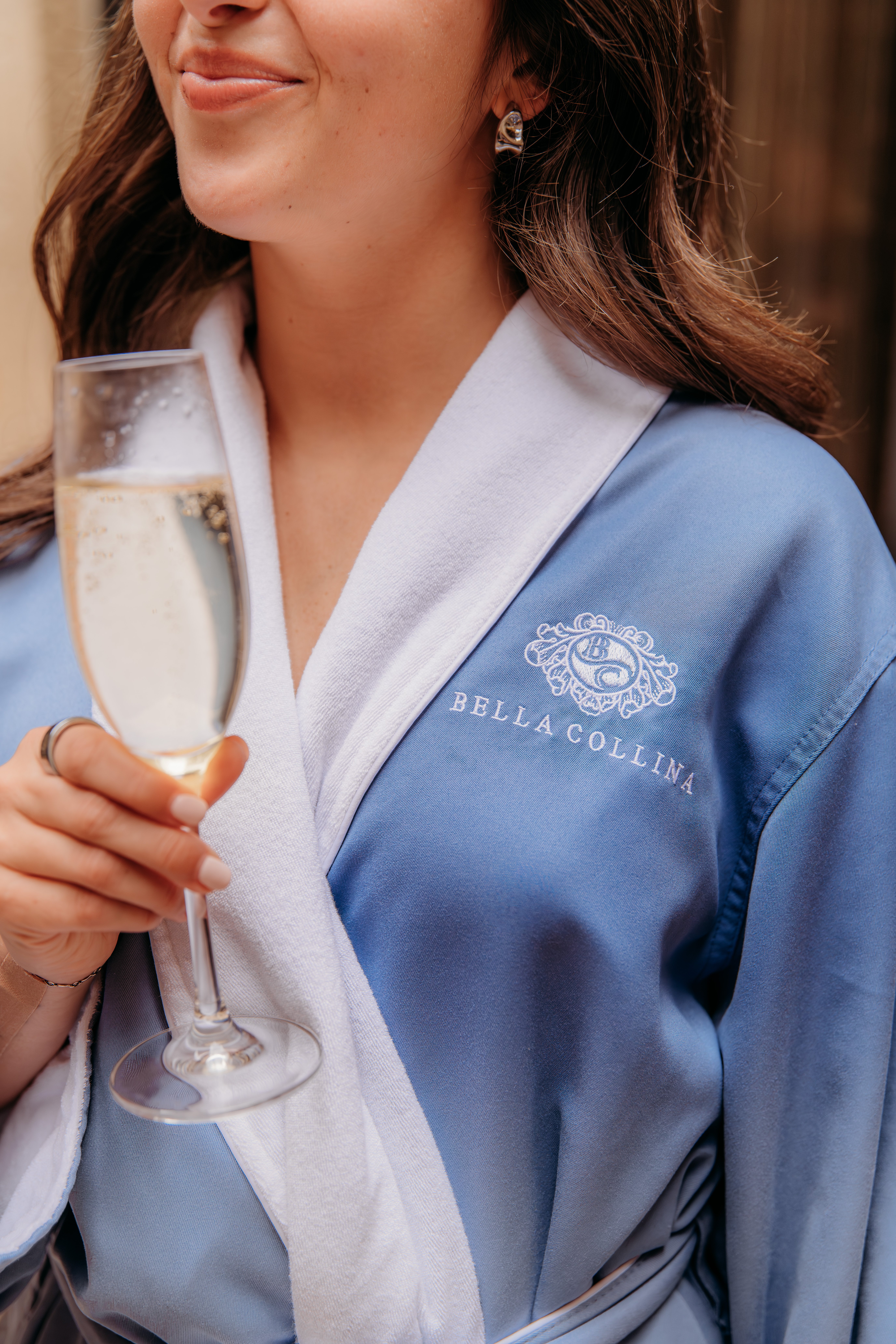 Lady enjoying champagne at the Spa at Bella Collina