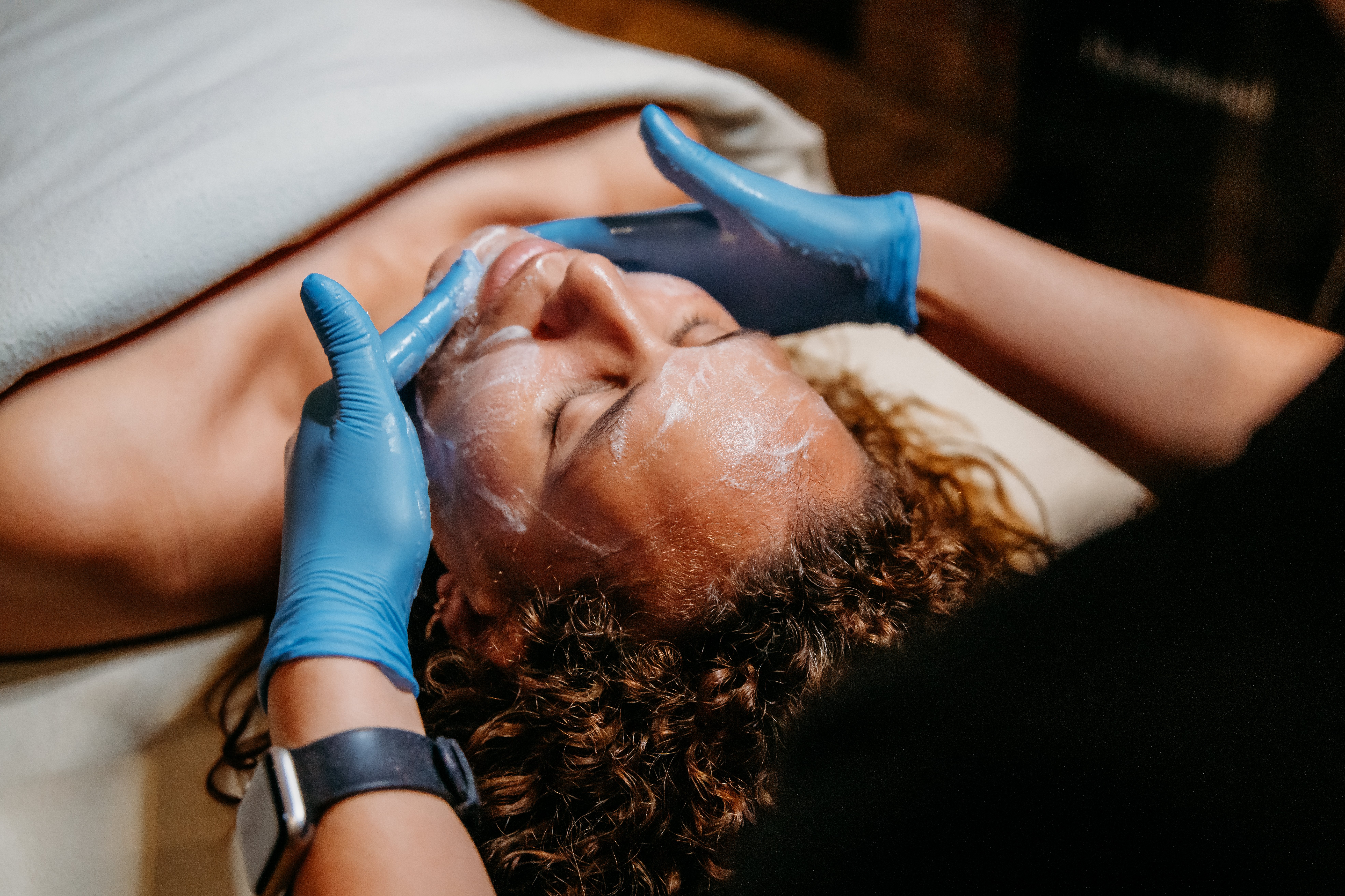 Woman receiving anti-aging facial at the Spa at Bella Collina