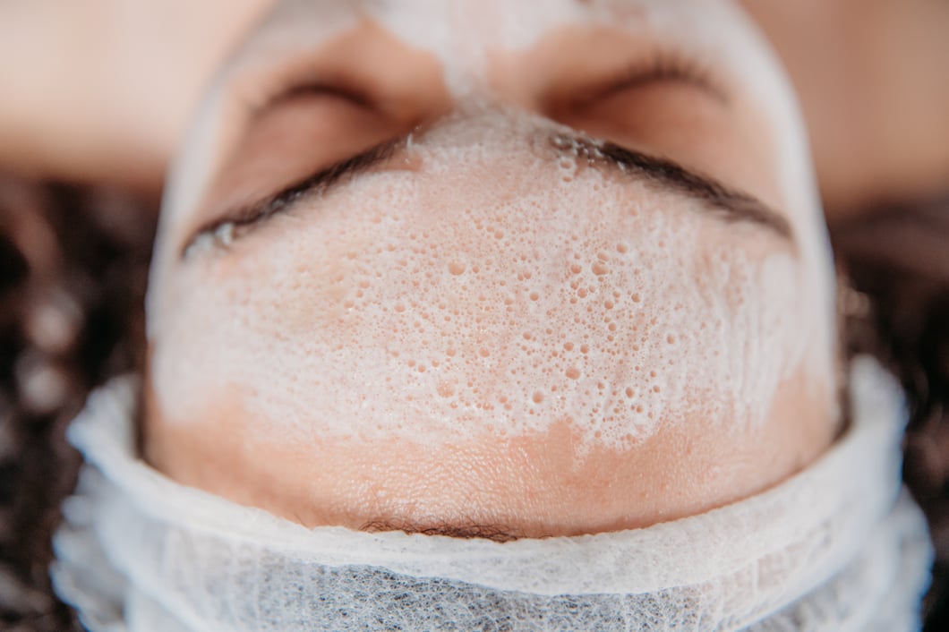Woman getting a cleansing facial at the Spa at Bella Collina