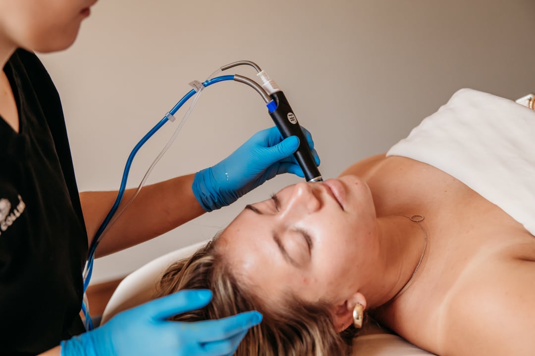 Woman receiving a HydraFacial treatment at The Spa at Bella Collina
