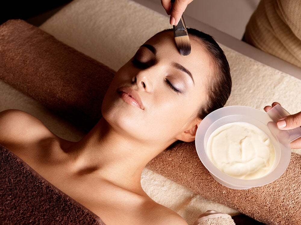 Woman receiving an organic facial treatment at the Spa at Bella Collina