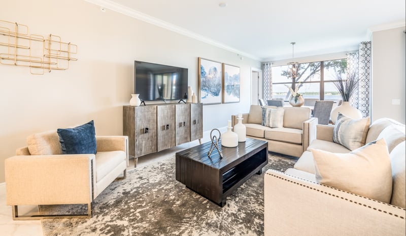 Three-bedroom Siena at Bella Collina condo with spacious living room and lake views