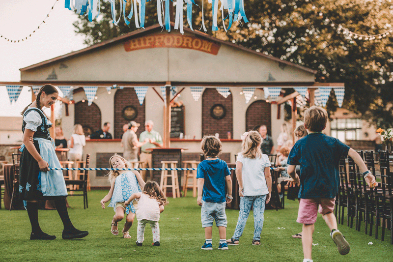 8 Benefits of Living in a Lakefront Home - Children playing at a celebration - Bella Collina