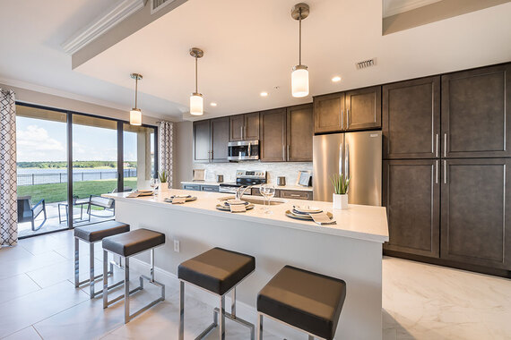 Two-bedroom plus den Siena at Bella Collina condo with kitchen island and lake views