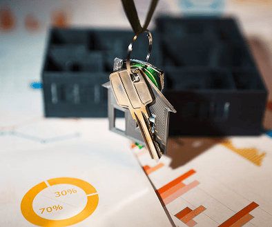 House keys displayed with real estate documents