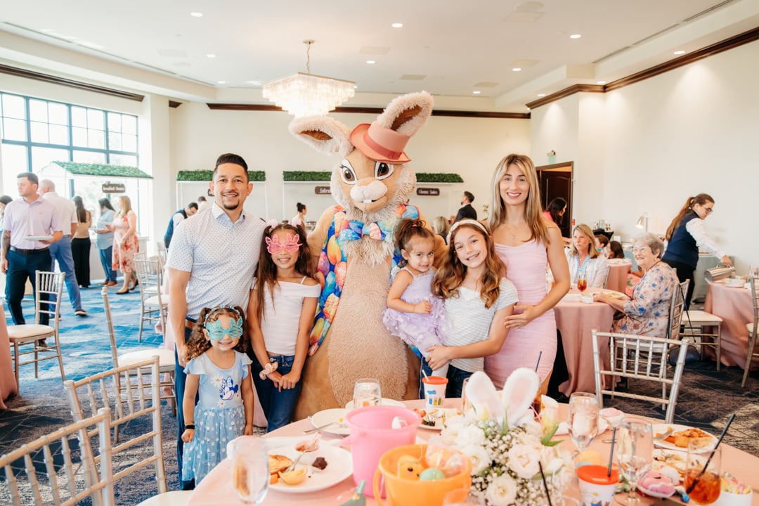 Group posing with Easter bunny at Bella Collina member event