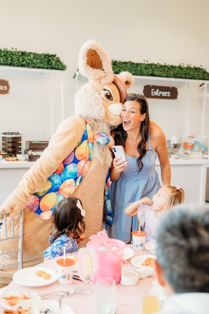 Woman with Easter bunny at Bella Collina member event