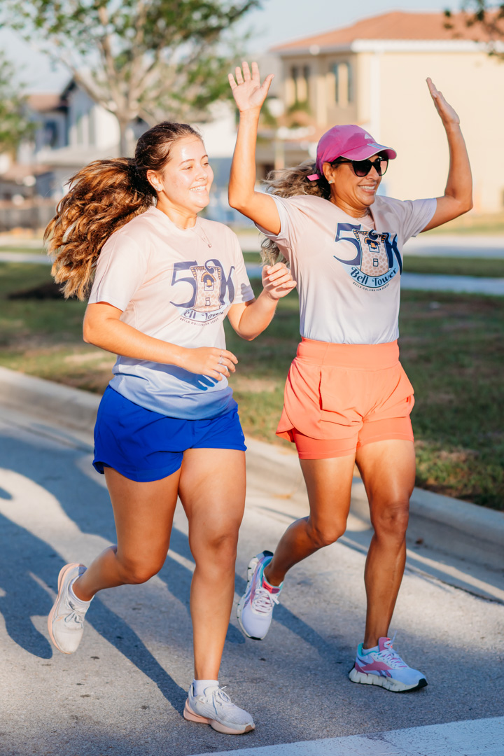 2 women running in a Bella Collina member event