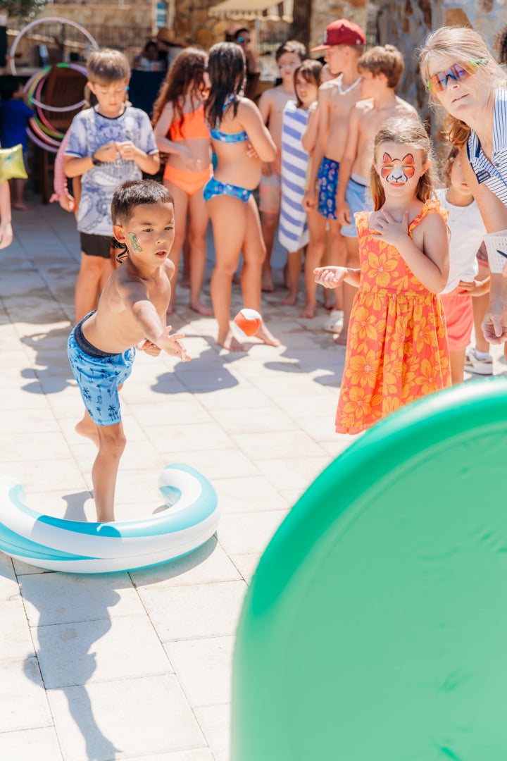 Kids playing in water at a Bella Collina event