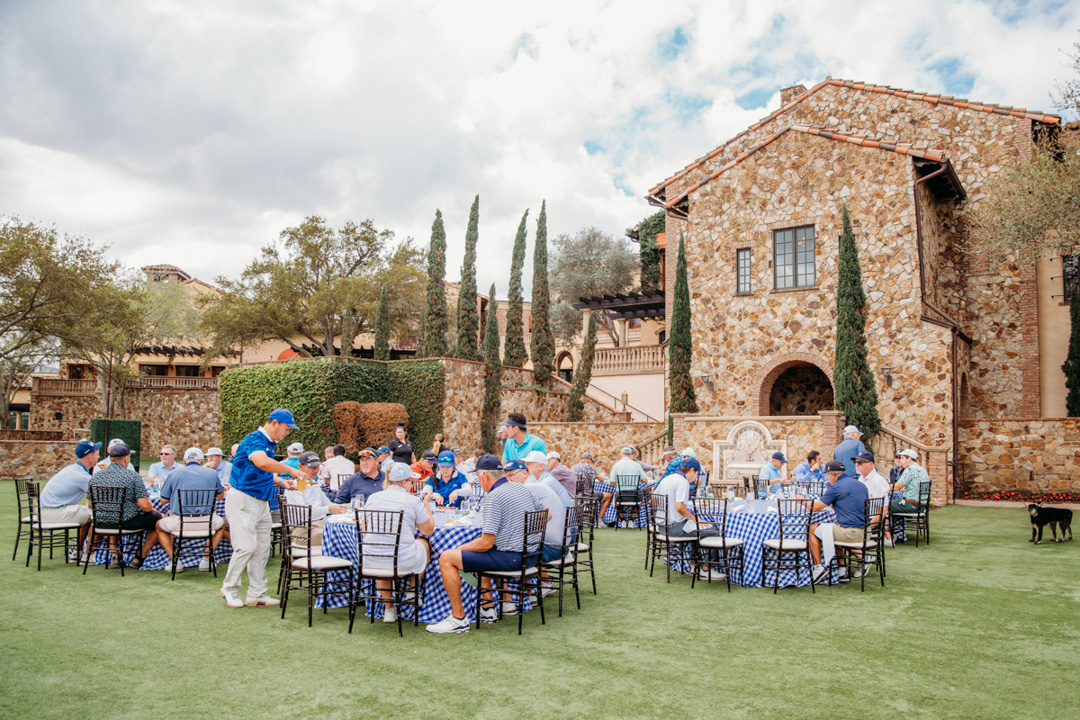Golfers enjoying meal on Bella Collina's Grand Lawn