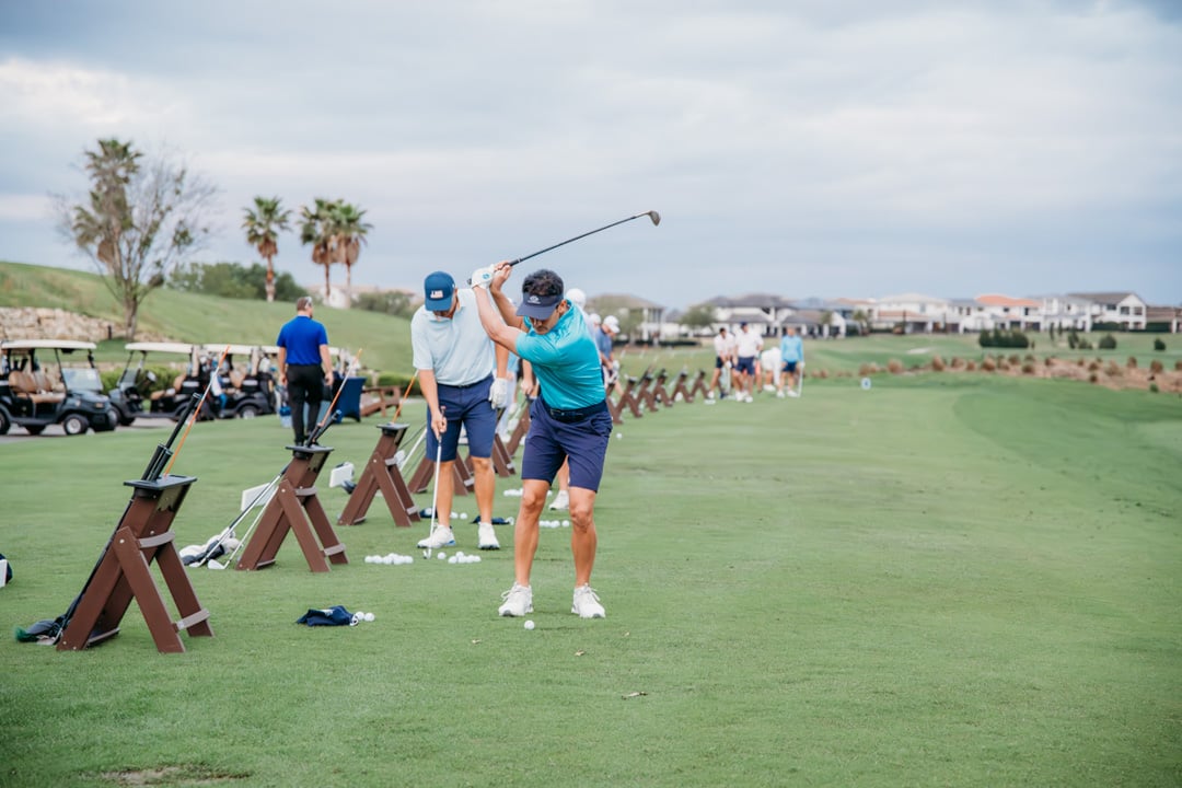 Golfer practicing at Bella Collina golf range