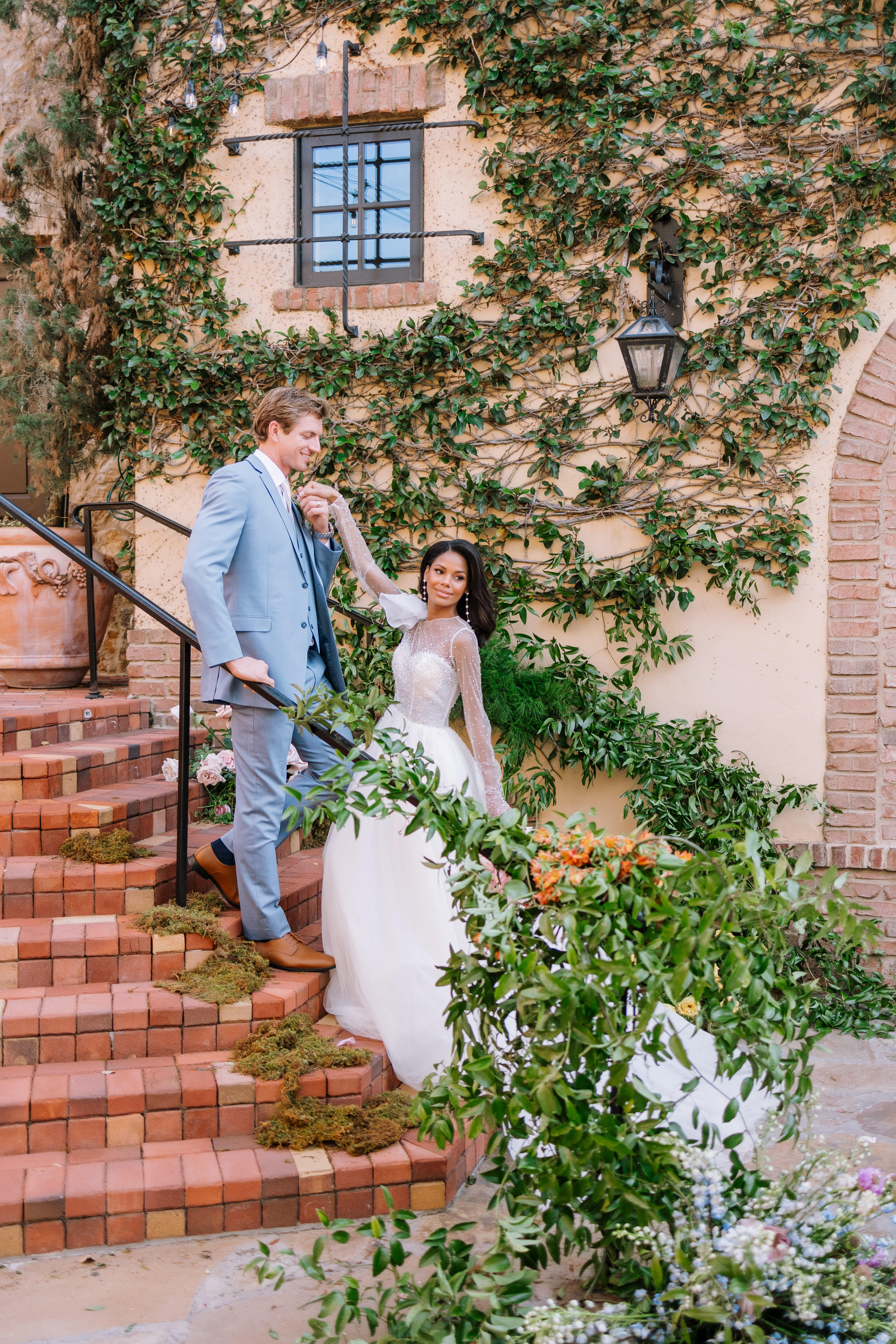 Couple standing at Bella Collina bell tower stairway