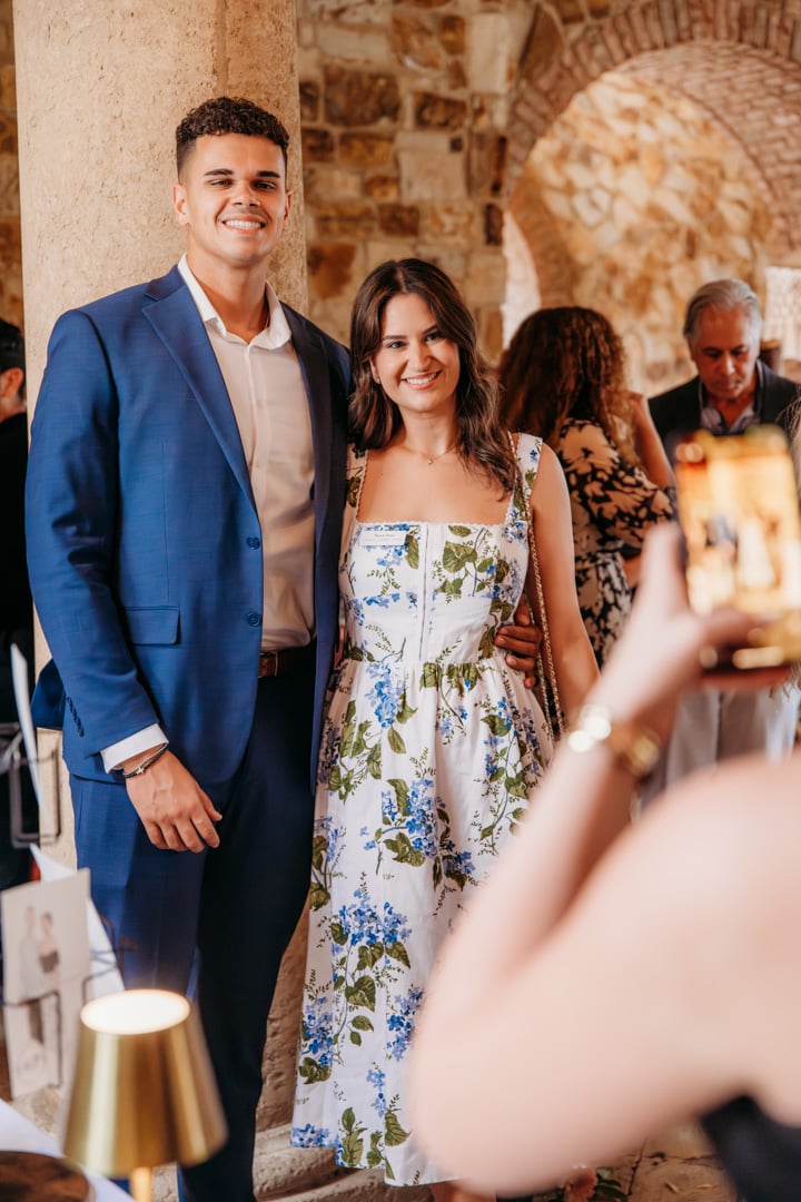 Couple having their picture taken at a Bella Collina wedding tasting event