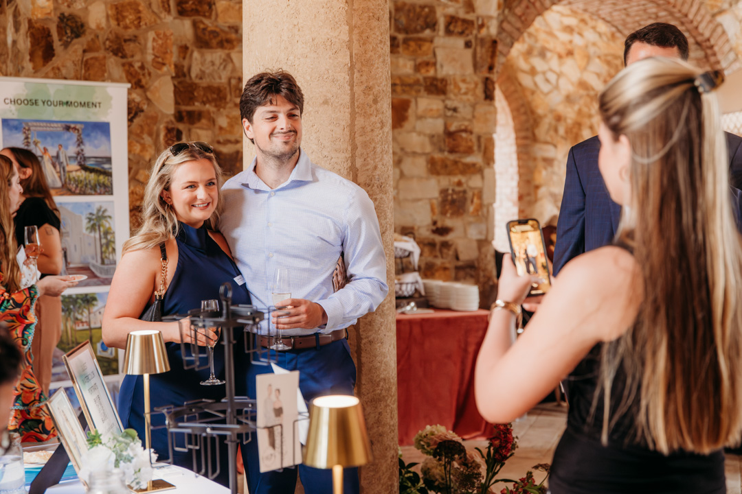 Couple have picture taken at Bella Collina wedding tasting event