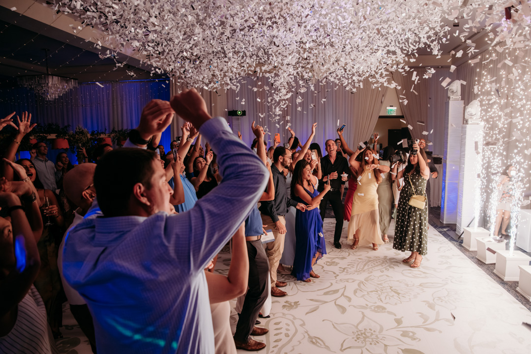 Wedding reception with confetti in Ballroom at Bella Collina