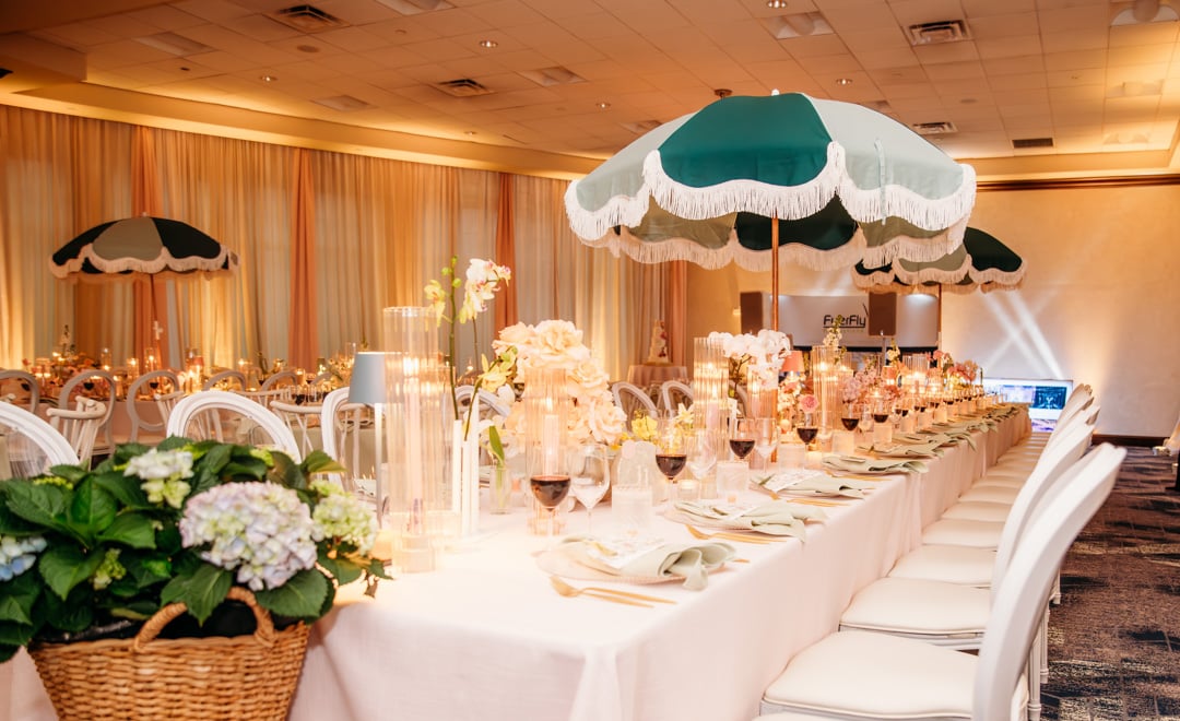 Reception setup with umbrellas in the Ballroom at Bella Collina
