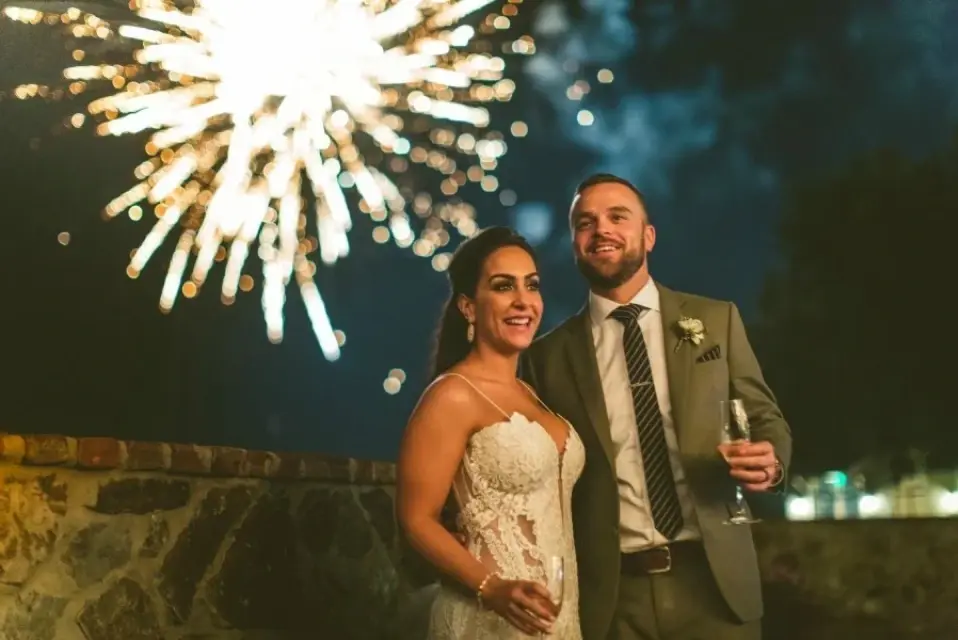 Bride and groom celebrating with fireworks at Bella Collina