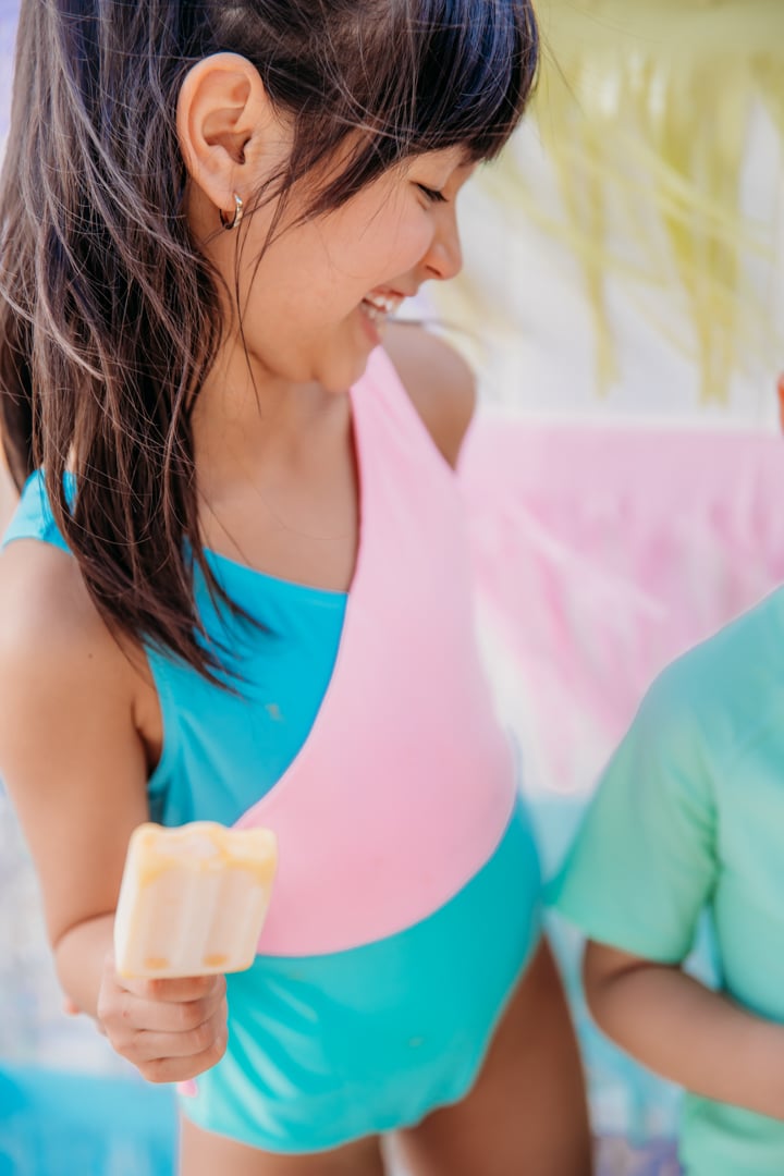 Girl Enjoying La Piscina Pool Party Popsicles 