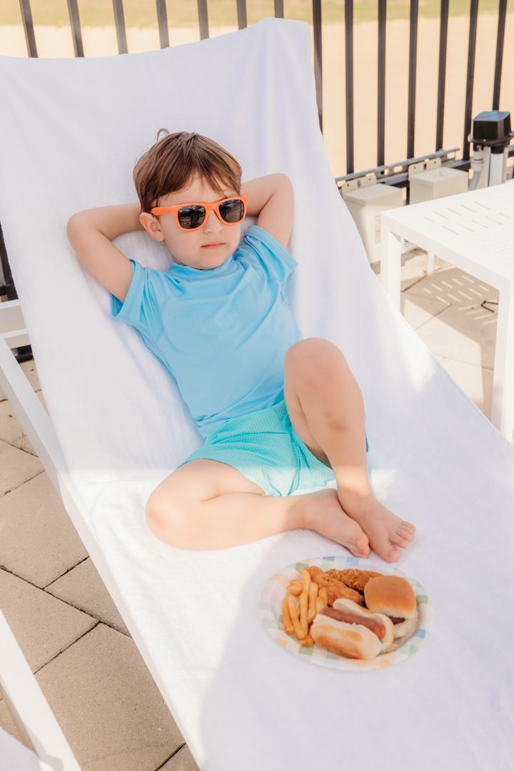Boy Relaxing at La Piscina Pool Lounge Chair