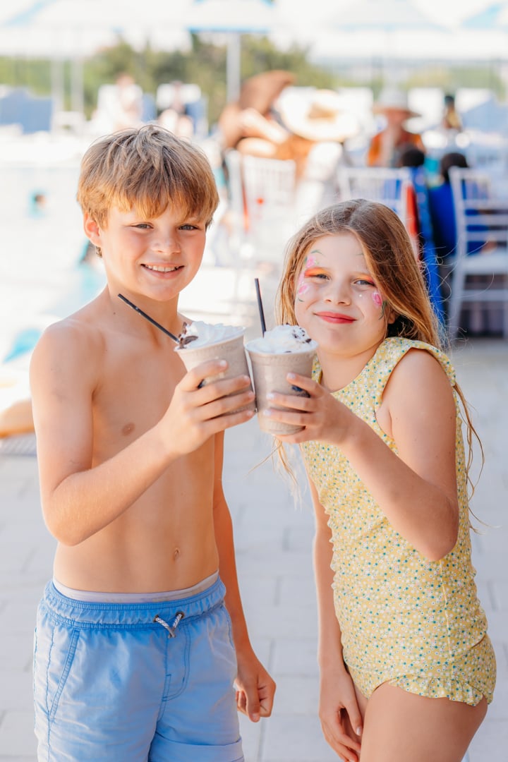 Kids enjoying La Piscina Pool Party Milkshakes