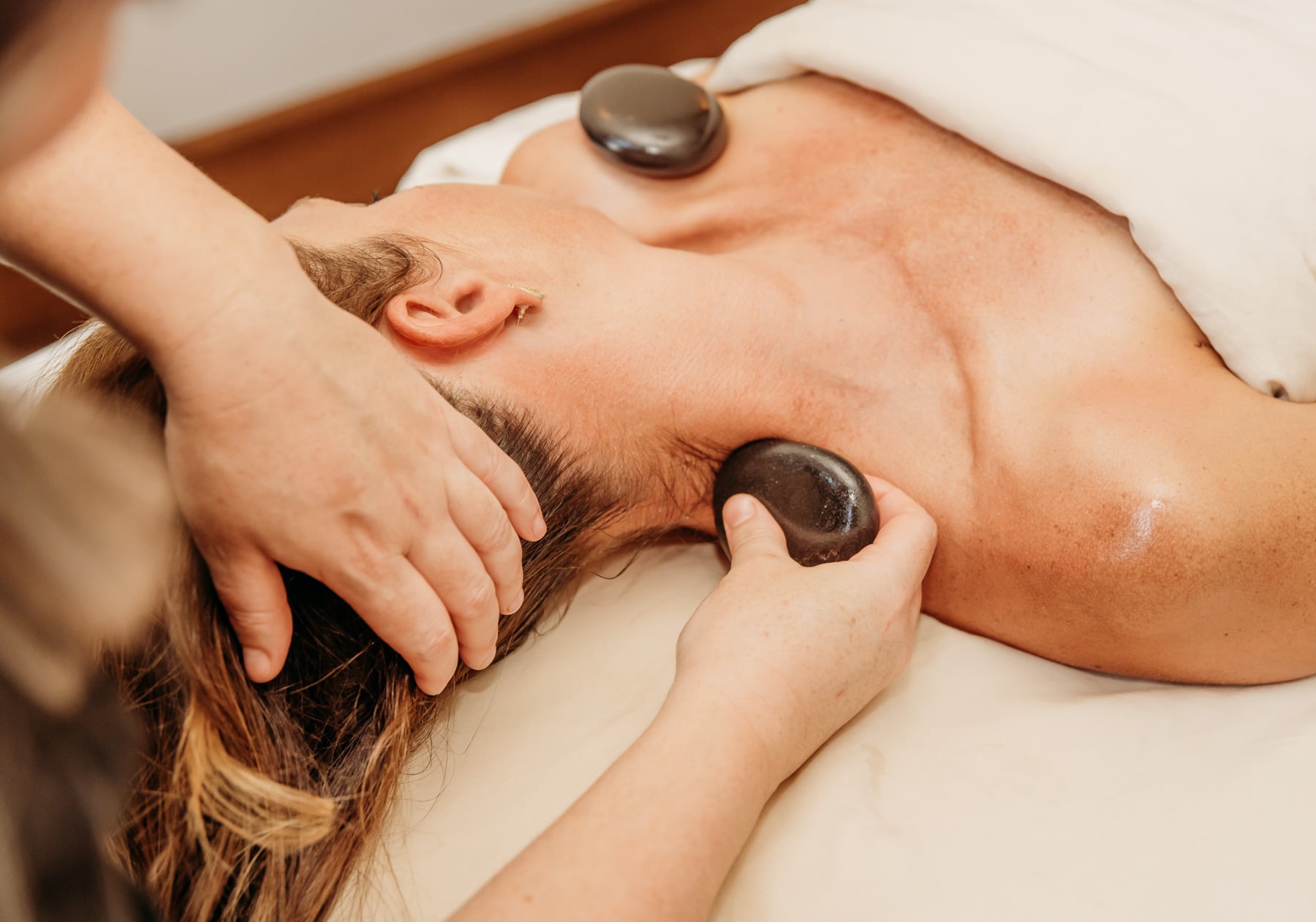 Woman Getting Hot Stone Massage