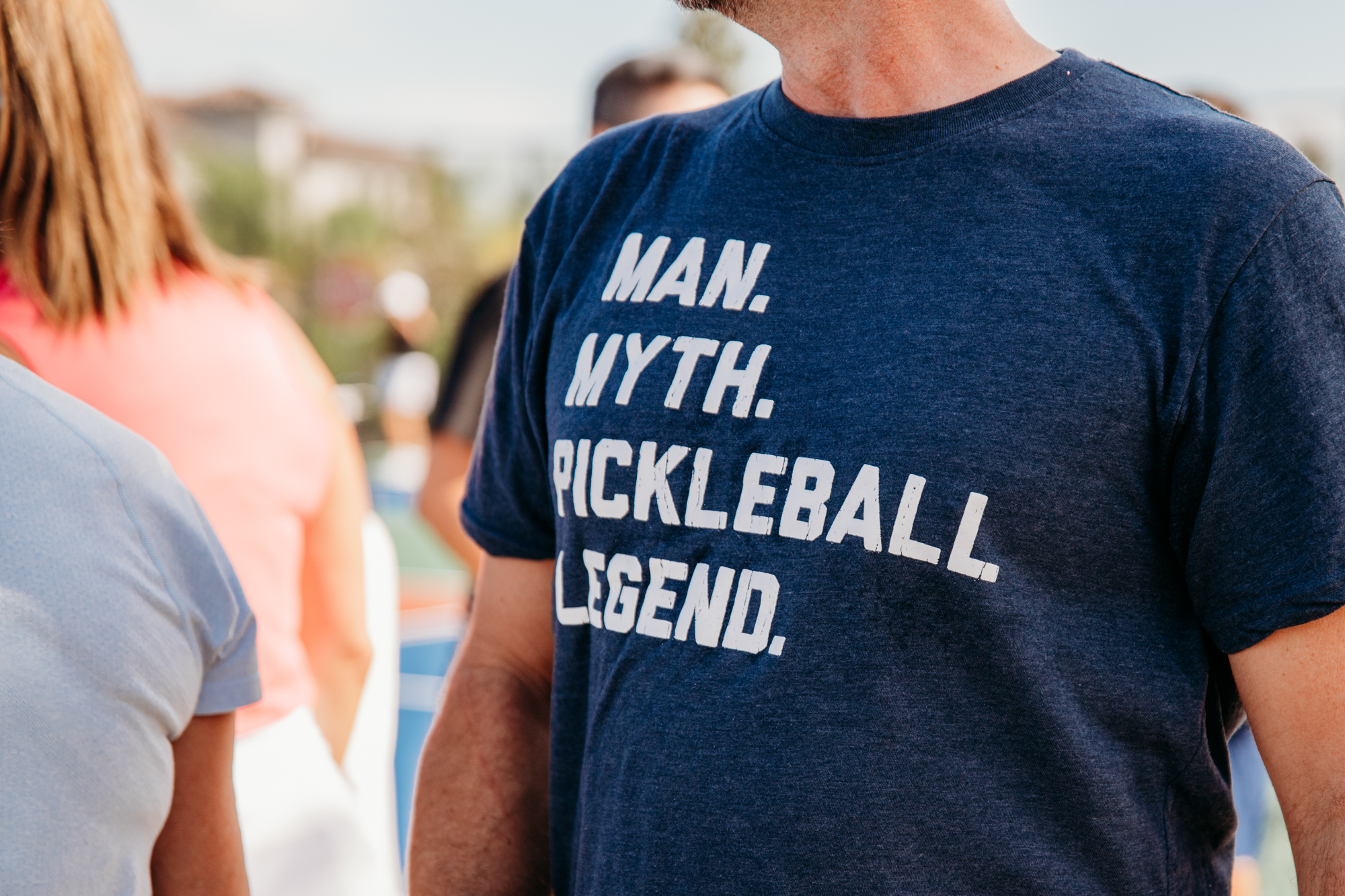 Man wearing pickleball-themed t shirt at Bella Collina