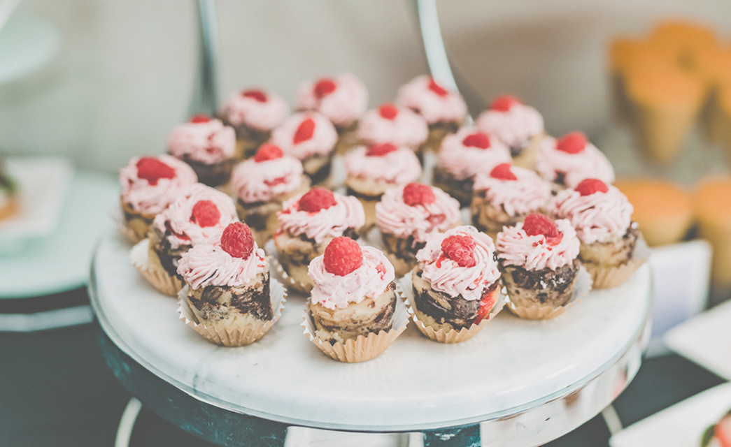 Mini raspberry-topped desserts displayed at Bella Collina wedding tasting event