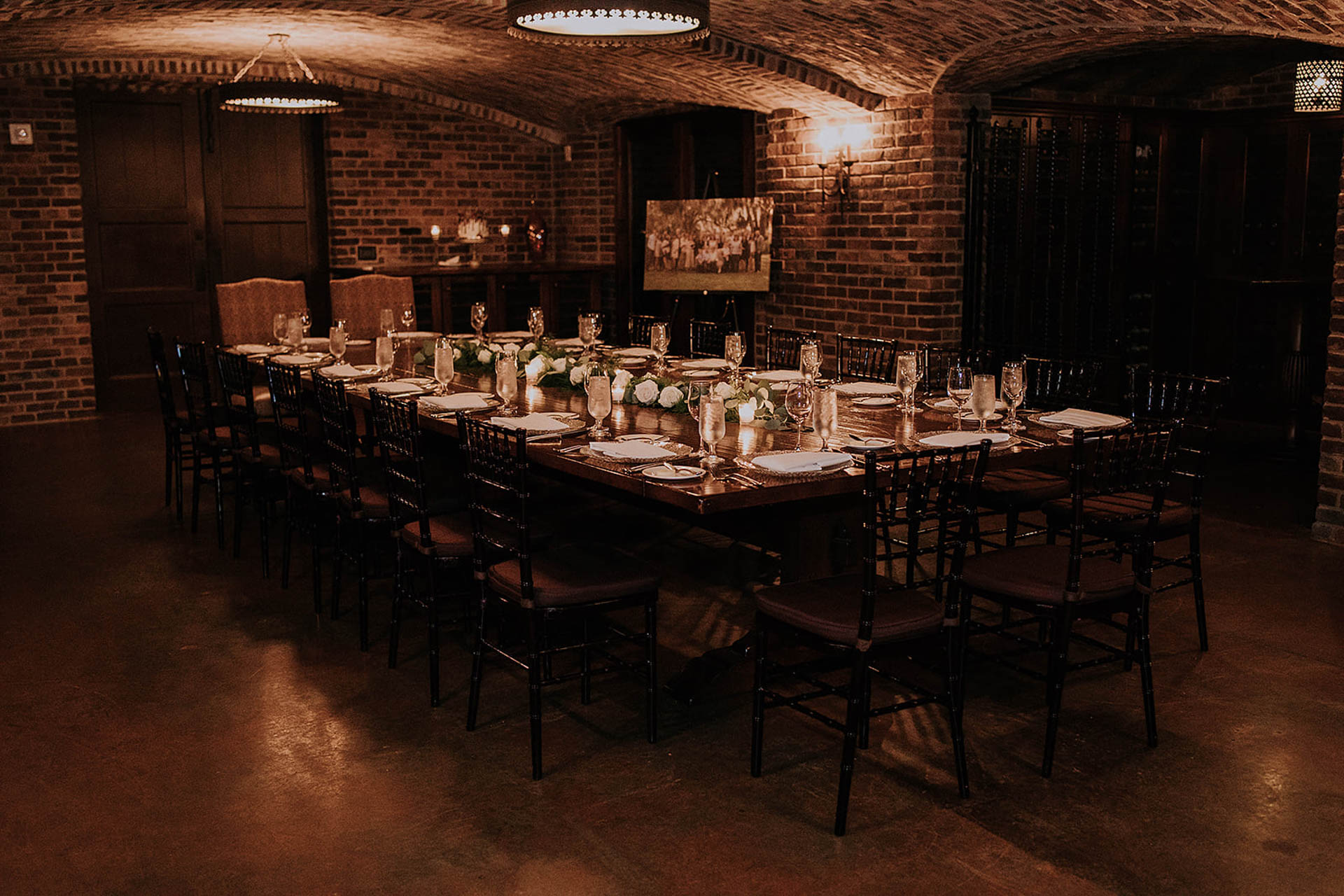 Dining table set for an event in the Wine Cellar at Bella Collina