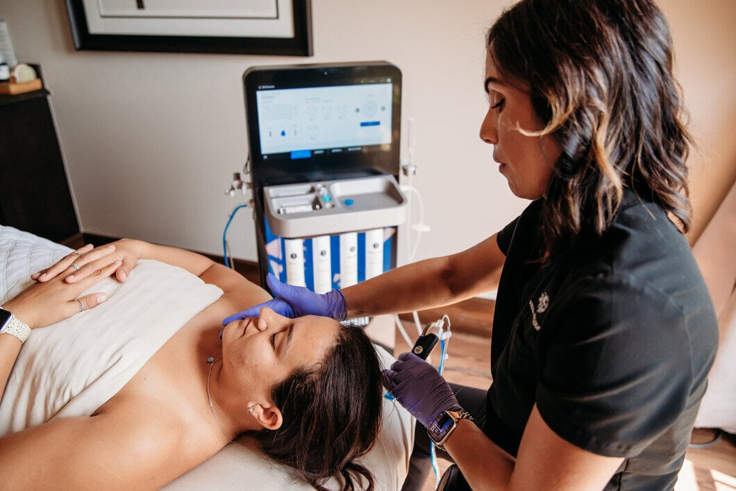 Woman receiving HydraFacial treatment at the Spa at Bella Collina
