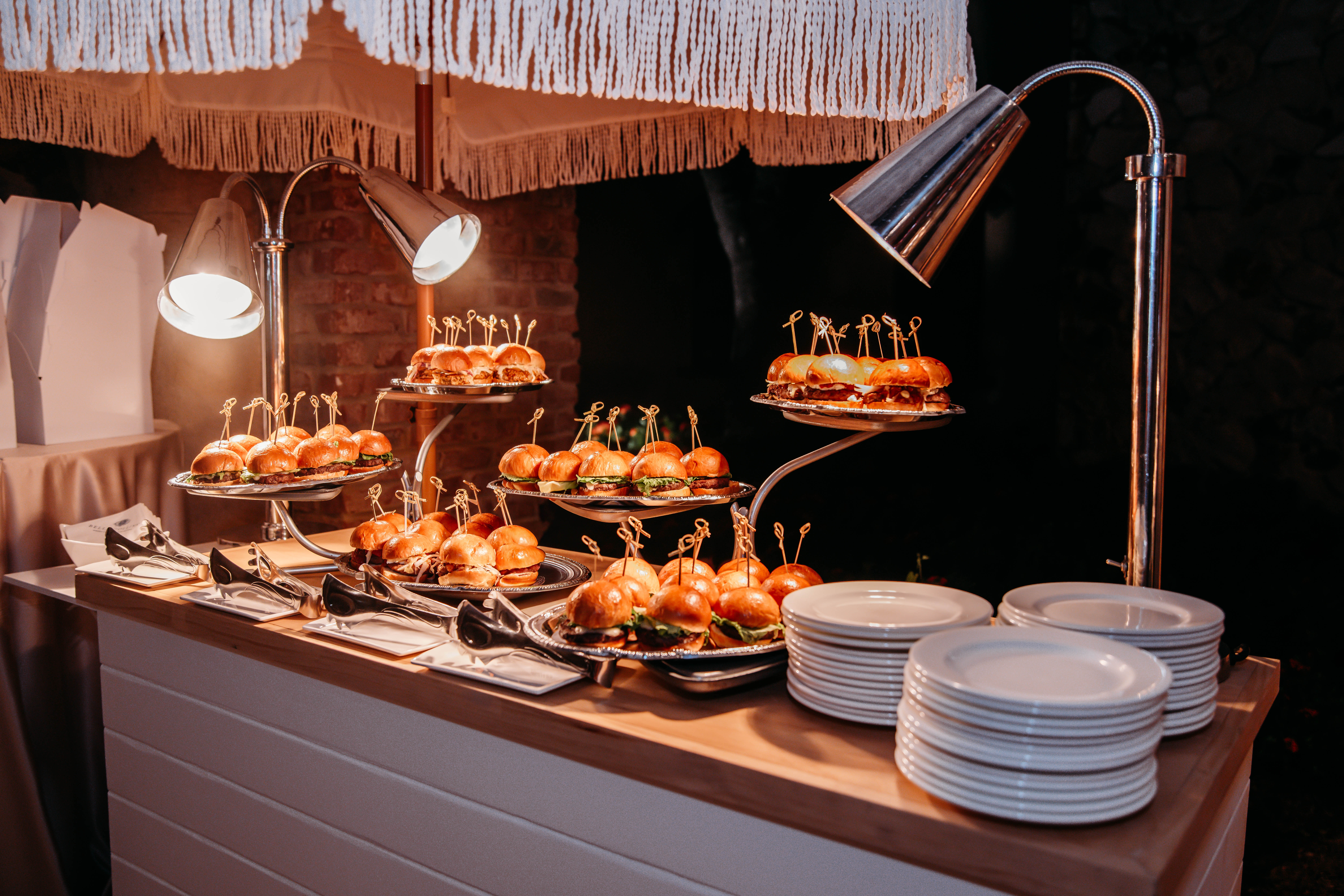 Gourmet sliders displayed at a wedding food station at Bella Collina
