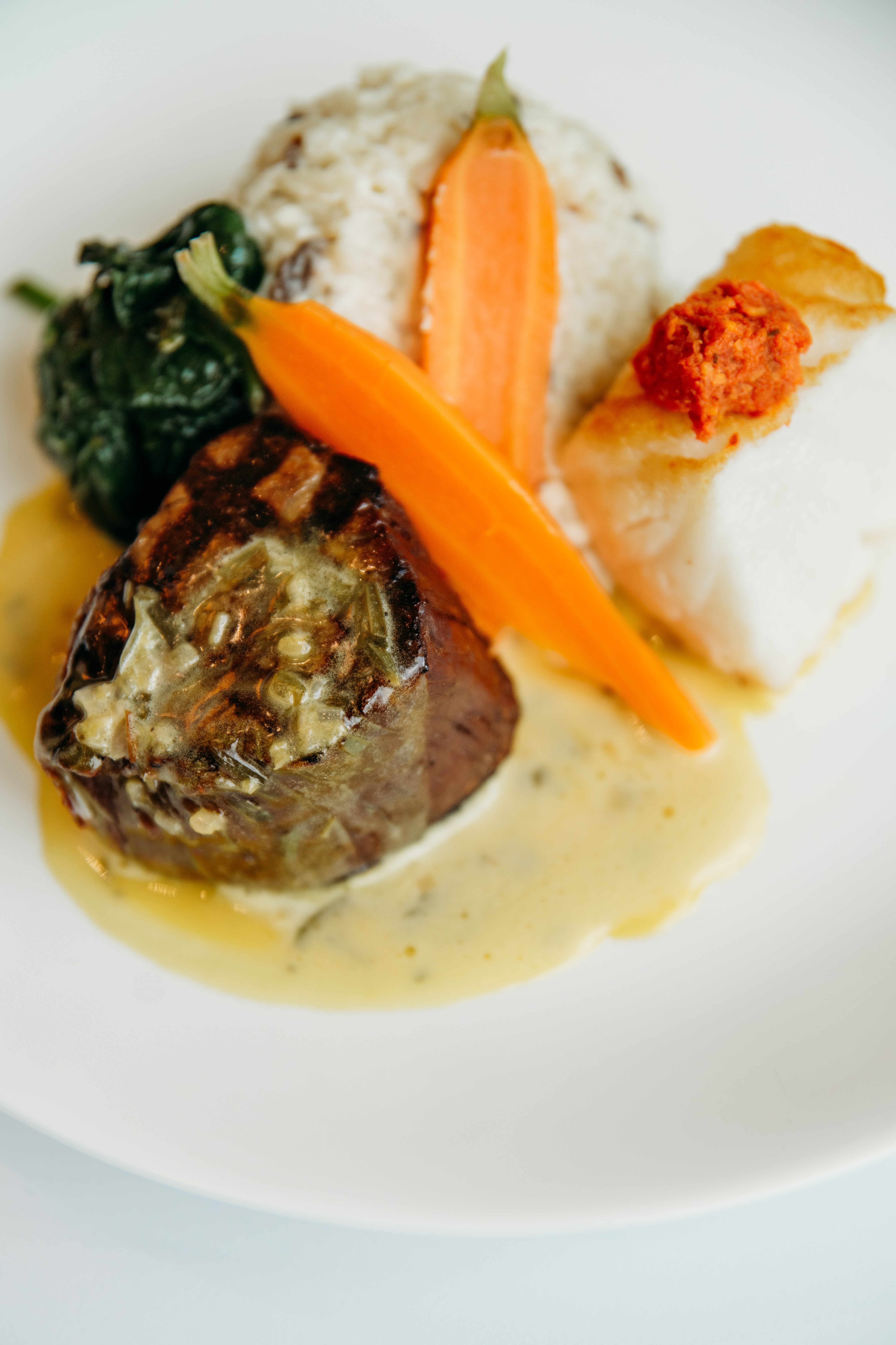 Surf & Turf Seared Filet and Sea Bass entree at Bella Collina