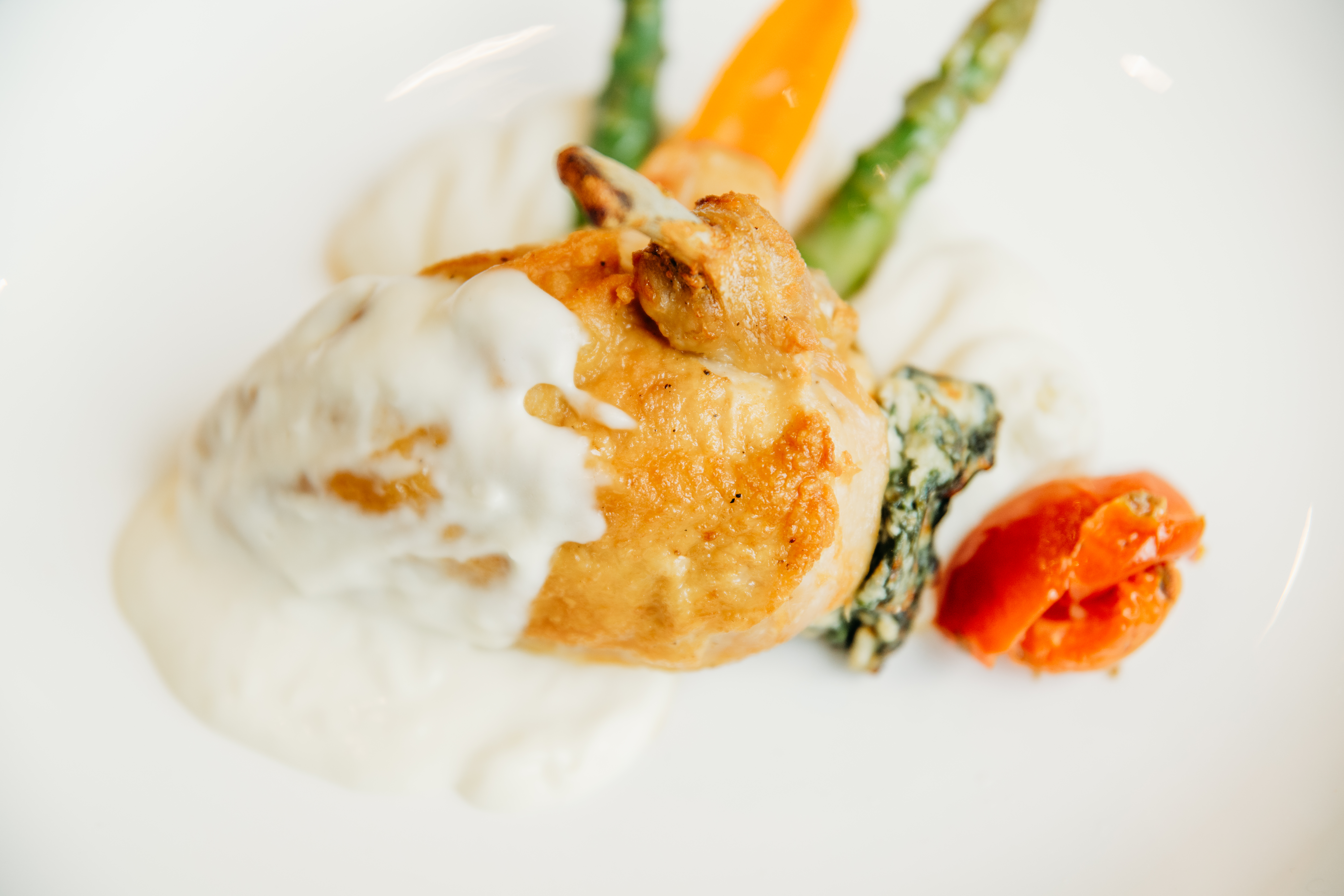 Spinach + Ricotta Stuffed Chicken entree at Bella Collina